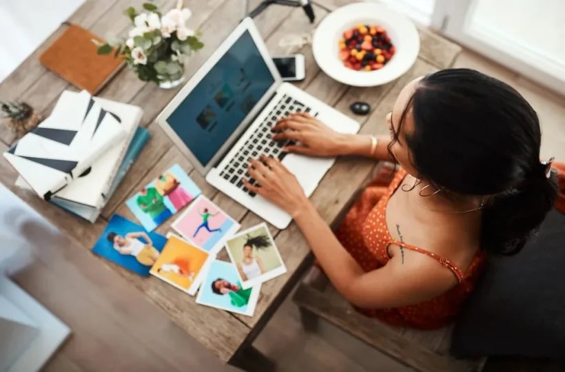 Woman writing a blog on a computer